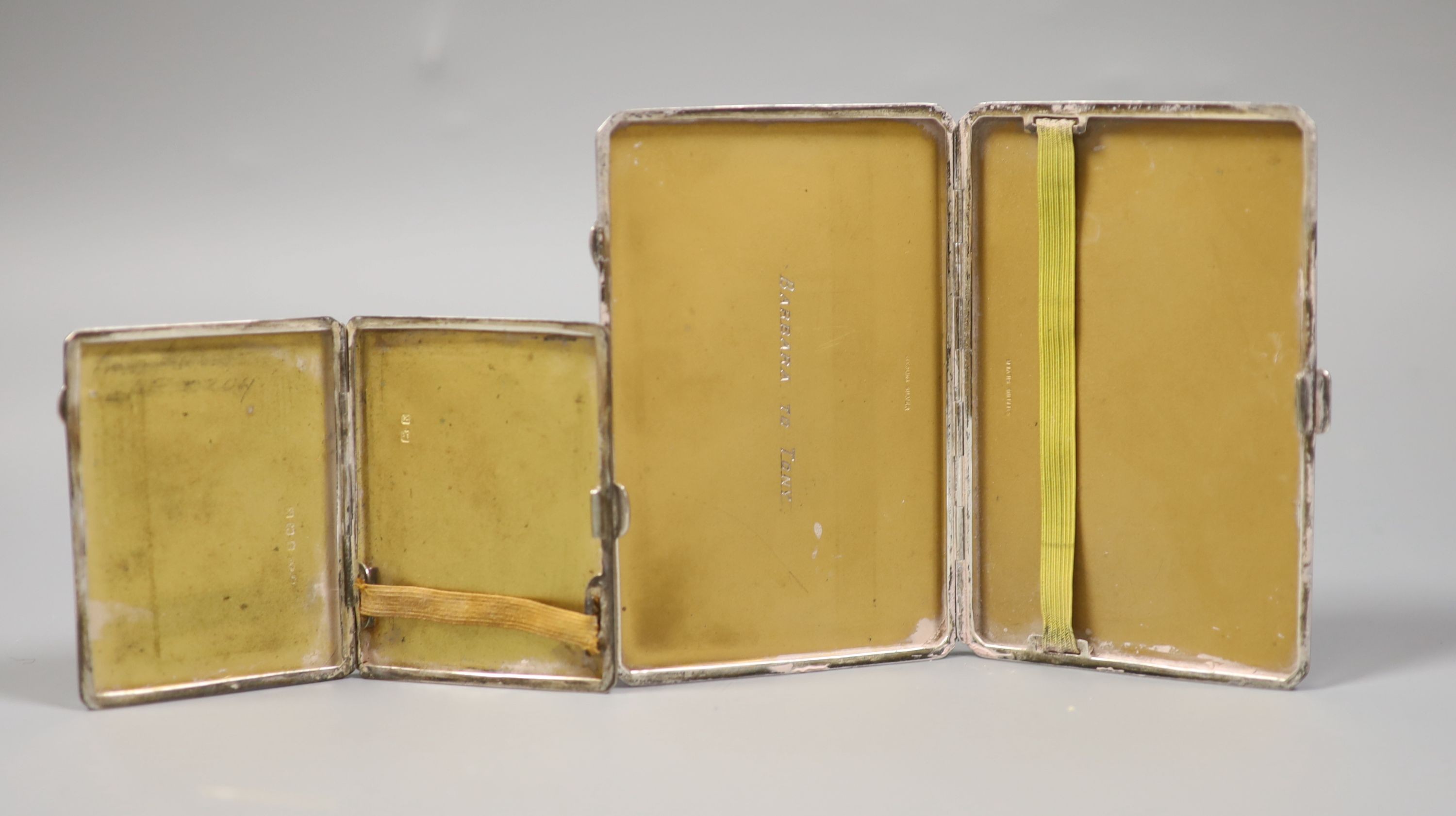 A sterling rectangular cigarette case, 12.6cm and a smaller silver cigarette case, gross 8oz.